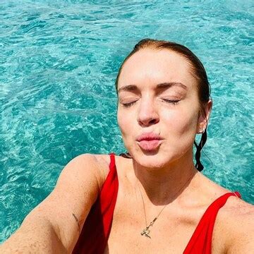 lindsay lohan wearing red gucci bikini|Lindsay Lohan bares it all in plunging red swimsuit in Maldives.